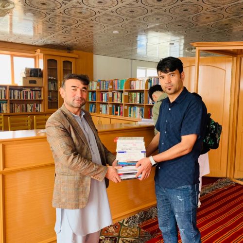 Sir Abdullah Yousufi Donating English Books to Shahid Baba Mazari Library